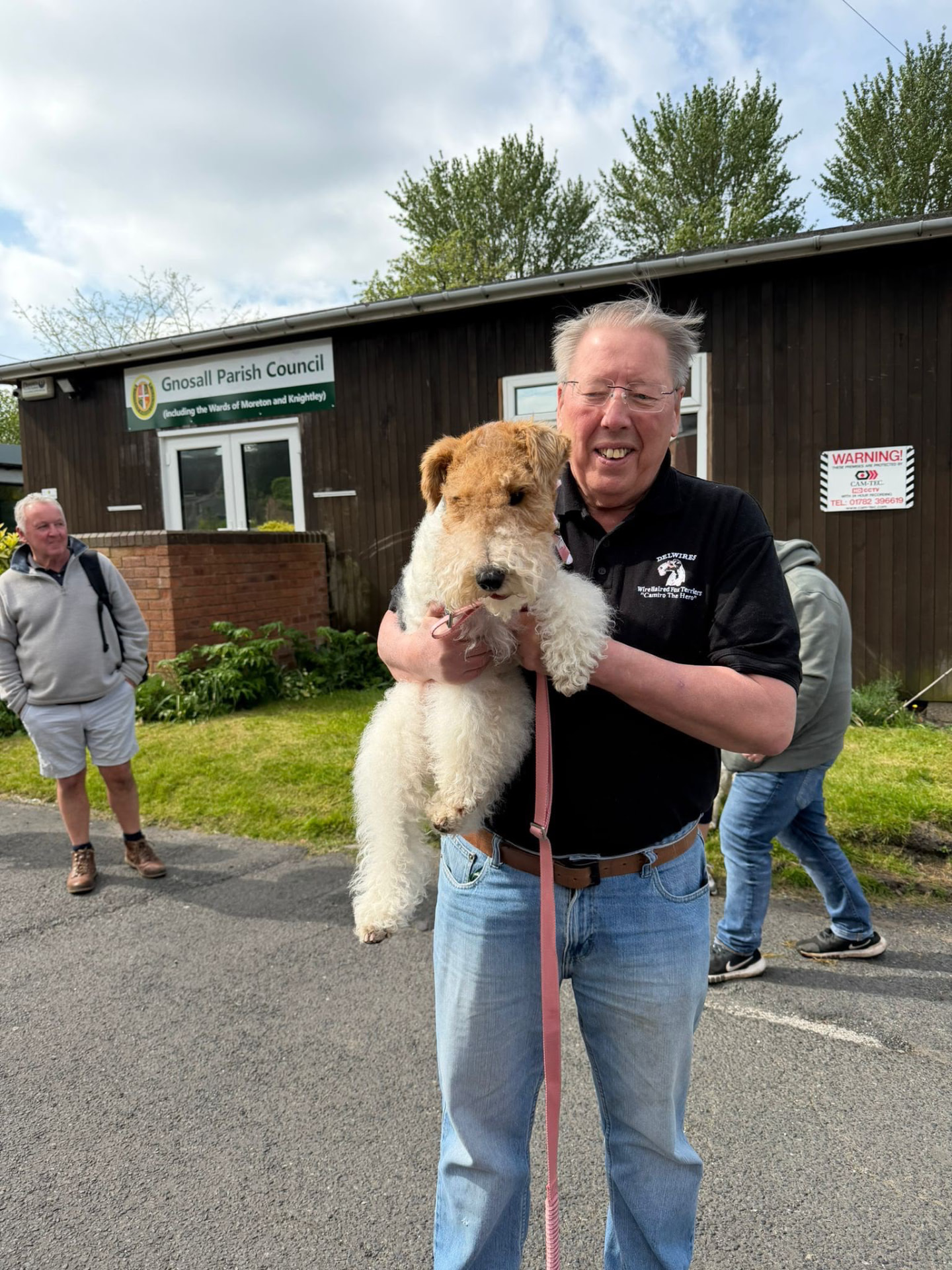 A Wire Haired Fox Terrier with its owner
